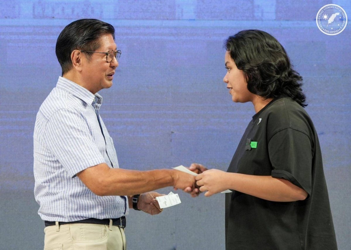 President Ferdinand Marcos Jr. meets one of the scholars who received aid from the government on June 3, 2026. PCO photo